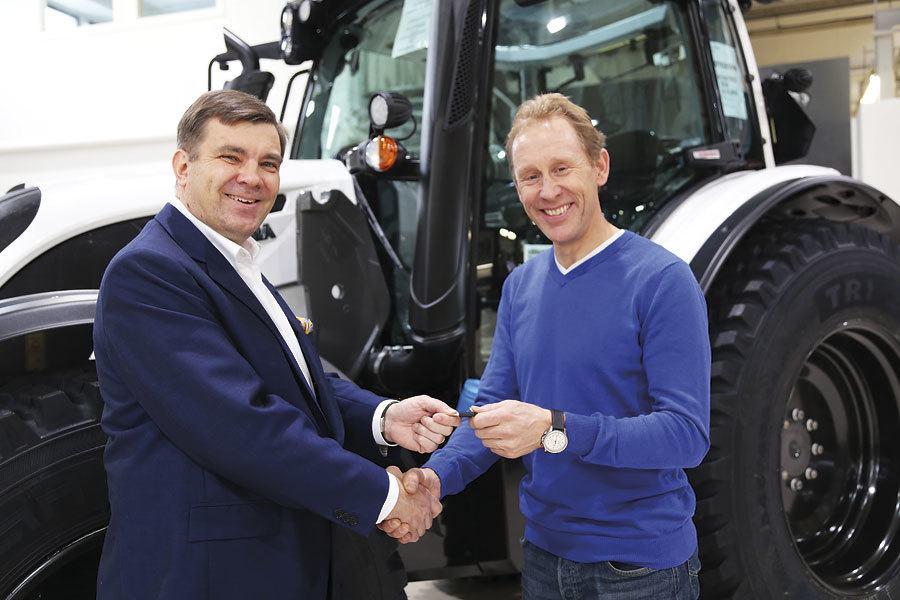 Cross-country four time olympic medalist Gunde Svan and Jari Rautjarvi, Managing Director of Valtra handing out new the keys to Gunde in the Suolahti factory, Finland