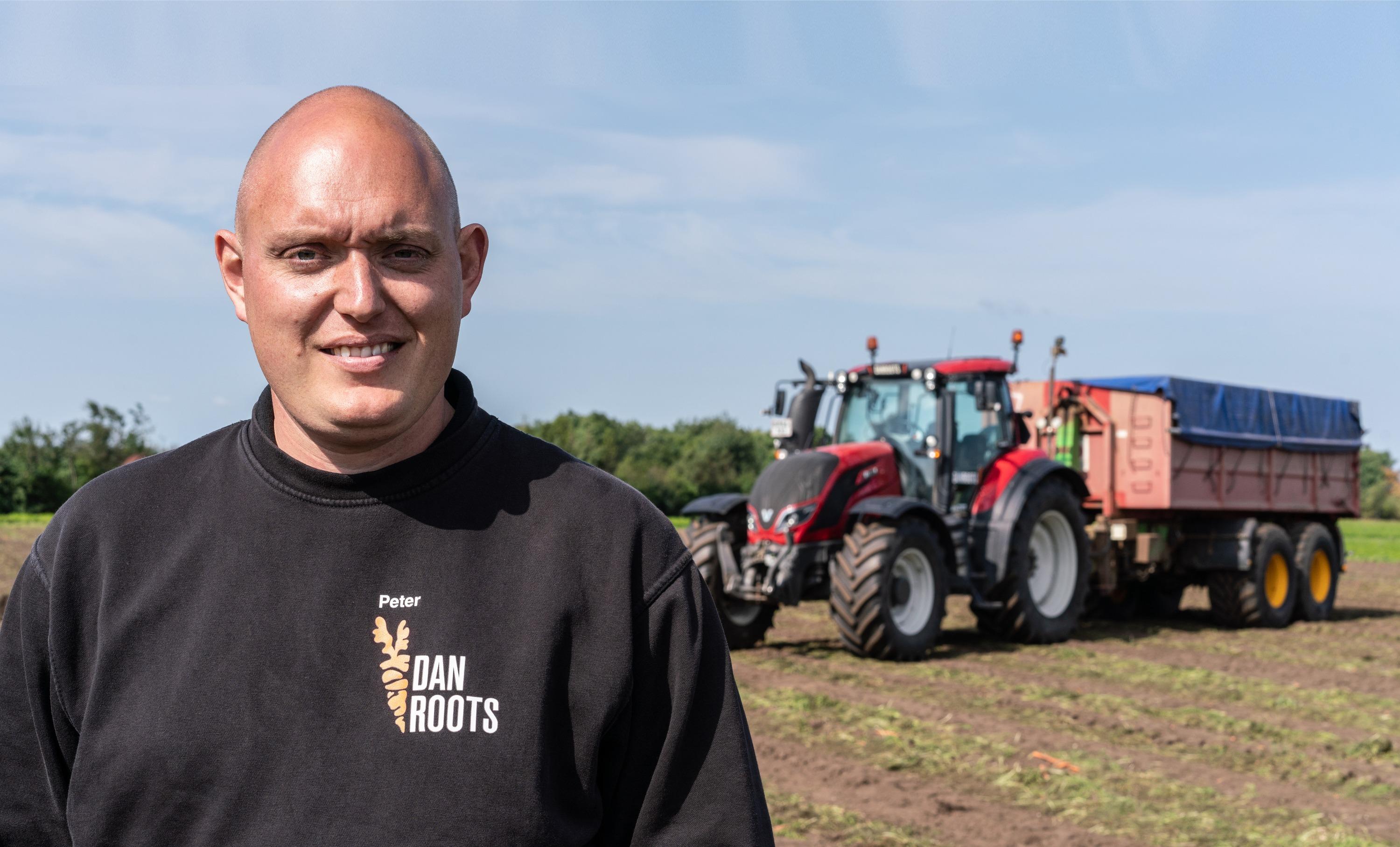 Peter Vestergaard from DanRoots and Valtra T series tractor in the background